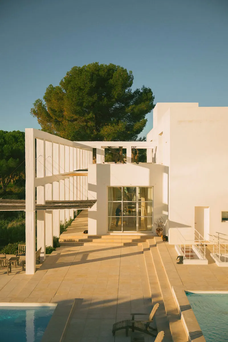 White steps and terraces of the house at golden hour